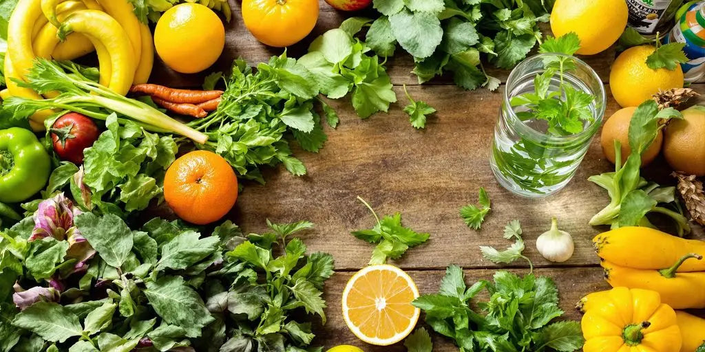 Photo of vibrant fresh produce and detox ingredients arranged naturally.