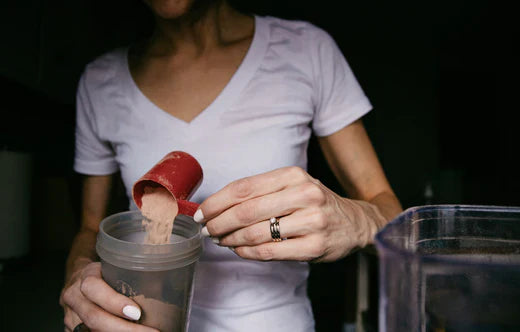 Morning Routine: Hands adding meal shake powder to a cup