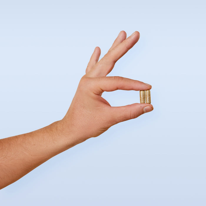 A person's hand with a ring on it
