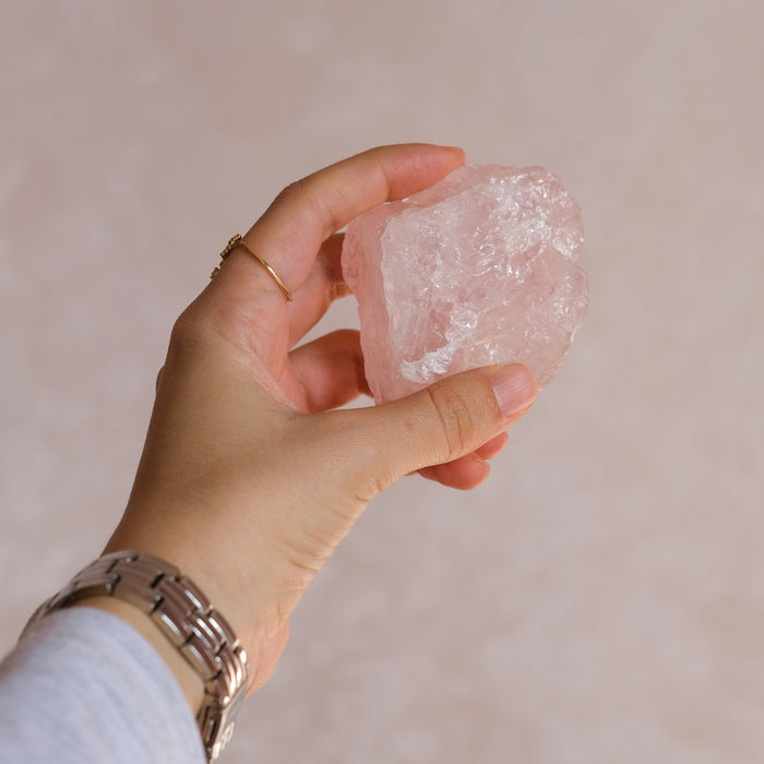 A person holding a piece of ice in their hand