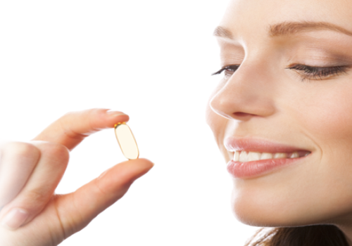 A_woman_about_to_take_a_supplement