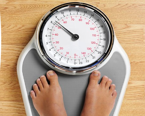 two_feet_on_a_weighing_scales
